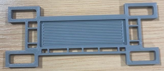 3D CAD render of a bipolar plate with serpentine flow channels